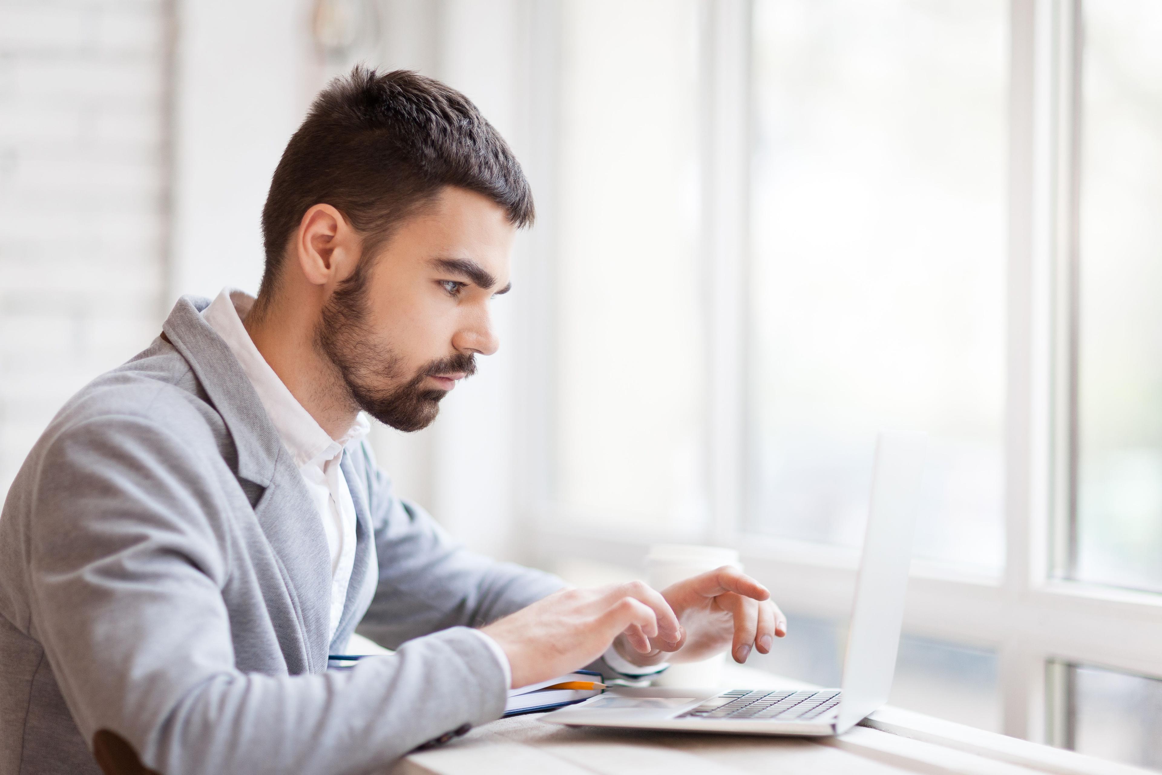 Bearded Businessman Wrapped Up In Work 389402